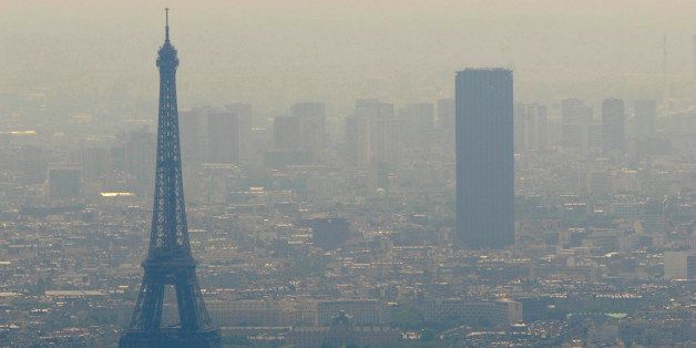 An aerial picture taken aboard an helicopter on July 20, 2010 shows a smoggy view of the Eiffel tower (L) and the Tour Maine-Montparnasse in Paris. AFP PHOTO BORIS HORVAT (Photo credit should read BORIS HORVAT/AFP/Getty Images)