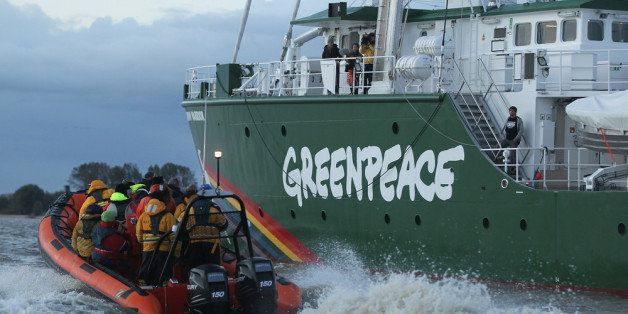 HAMBURG, GERMANY - OCTOBER 20: The Rainbow Warrior III, the newest ship of the enivornmental conservation organization Greenpeace, is accompanied by Greenpeace activists and members of the media on the Elbe River on its way to port on October 20, 2011 in Hamburg, Germany. The Rainbow Warrior III, 53 meters long, designed by Greenpeace and built in Poland and Germany, is a EUR 23 million project completed last week. (Photo by Sean Gallup/Getty Images)
