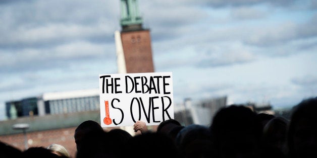 People scream outside the United Nations Intergovernmental Panel on Climate Change (IPCC) to demand immediate political action on Climate debate on September 27, 2013 in Stockholm. The panel said it was more certain than ever that humans were the cause of global warming and predicted temperatures would rise another 0.3 to 4.8 degrees Celsius this century. AFP PHOTO/JONATHAN NACKSTRAND (Photo credit should read JONATHAN NACKSTRAND/AFP/Getty Images)