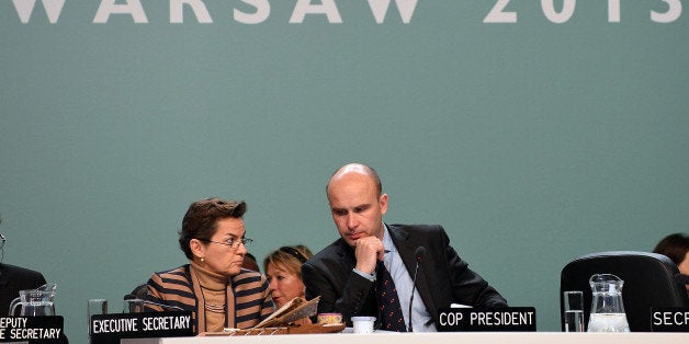 Poland's former Environment Minister, COP President Marcin Korolec and Christiana Figueres (L), Executive Secretary of the United Nations Framework Convention on Climate Change attend the 19th conference of the United Nations Framework Convention on Climate Change COP19 in Warsaw on November 22, 2013. The UN climate change conference that is to lay the groundwork for a new pact to prevent global warming, is scheduled to close Friday. AFP PHOTO / JANEK SKARZYNSKI (Photo credit should read JANEK SKARZYNSKI/AFP/Getty Images)