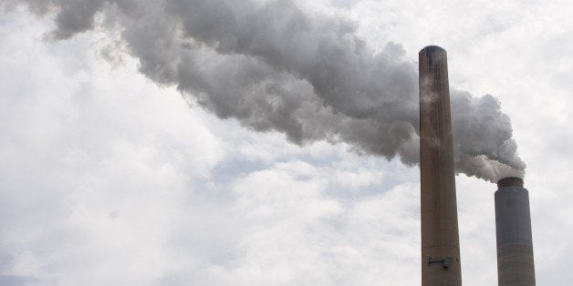 The smoke stacks at American Electric Power's (AEP) Mountaineer coal power plant in New Haven, West Virginia, October 30, 2009. In cooperation with AEP, the French company Alstom unveiled the world's largest carbon capture facility at a coal plant, so called 'clean coal,' which will store around 100,000 metric tonnes of carbon dioxide a year 2,1 kilometers (7,200 feet) underground. AFP PHOTO / Saul LOEB (Photo credit should read SAUL LOEB/AFP/Getty Images)