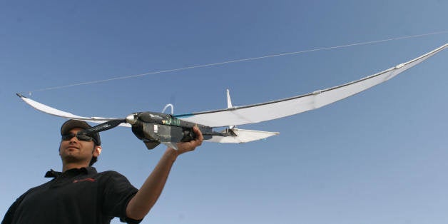 Redlands, UNITED STATES: Octatron designer Victor Torres prepares to launch the SkySeer Drone Unmanned Arial Vehicle (UAV),