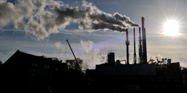 A photo taken on October 31, 2013 in Haubourdin, northern France shows smoke from a factory. AFP PHOTO PHILIPPE HUGUEN