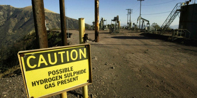 LOS PADRES NATIONAL FOREST, CA - AUGUST 4: A sign warns of possible hydrogen sulphide gas near oil rigs outside the Sespe Co