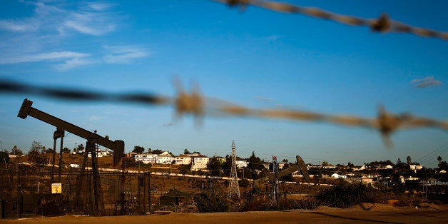 Pumpjacks operate near a hydraulic fracturing (fracking) test well at the Inglewood Oil field in Los Angeles, California, U.S