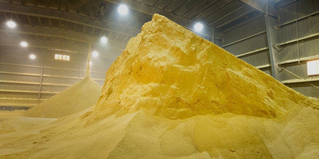 Dried distillers grains, a by-product of ethanol production used as feed for livestock, sit in a storage area outside the Gre