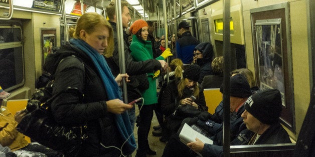 NEW YORK, NY - DECEMBER 14: Commuters ride the subway during rush hour December 14, 2013 in the Brooklyn borough of New York. (Photo by Robert Nickelsberg/Getty Images)