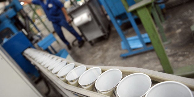 An employee of Massilly, a company which manufatures food metallic packaging, works on a line of cans covered by a polish containing the chemical Bisphenol-A, on October 8, 2012 in Massily. One year after the National Assembly, the French senate will exam on October 9, 2012, a socialist proposal for a law prohibiding the bisphenol-A used in the food packagings. BPA is used in the production of polycarbonated plastics and epoxy resins found in baby bottles, plastic containers, the lining of cans used for food and beverages, and in dental sealants. France has banned baby bottles containing the chemical due to suspicions that it harms human development. AFP PHOTO/PHILIPPE DESMAZES (Photo credit should read PHILIPPE DESMAZES/AFP/GettyImages)