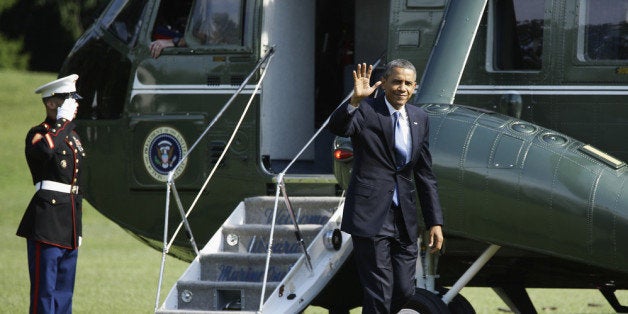 WASHINGTON, DC - JULY 30: U.S. President Barack Obama waves to the press as he returns to the White House, after speaking at the Amazon Fulfilment Center in Tennessee, on July 30, 2013 in Washington, DC. In his speech the president attacked republican efforts at job creation, including the Keystone XL pipeline, shrinking the Environmental Protection Agency, and repeated attempts in Congress to repeal the Affordable Care Act. (Photo by T.J. Kirkpatrick/Getty Images)