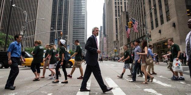 NEW YORK, NY - JUNE 18: Pedestrians cross Sixth Avenue, also known as 'Avenue of the Americas' on June 18, 2013 in New York