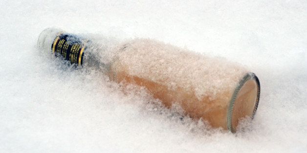 [UNVERIFIED CONTENT] A frozen bottle of beer lies in the snow.