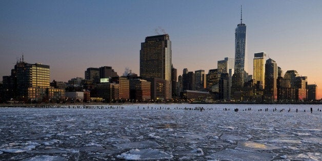 NEW YORK, NY - JANUARY 09: Ice floes fill the Hudson River as the Lower Manhattan skyline is seen during sunset on January 9