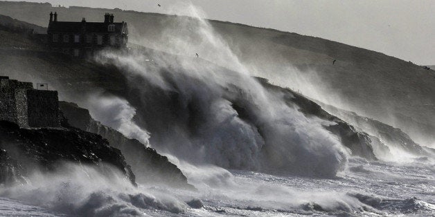 PORTHLEVEN, UNITED KINGDOM - FEBRUARY 08: Storm waves break on February 8, 2014 at Porthleven in Cornwall, England. The UK i