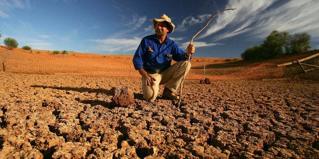 LEIGH CREEK, AUSTRALIA - JUNE 7: Stockman Gordon Litchfield from Wilpoorinna sheep and cattle station surveys the bottom of a dry dam on his property on June 7, 2005 in Leigh Creek, Australia. Australia is enduring its worst drought in decades and with the combined affect of increasing temperatures and the El Nino weather phenomenon there appears no sign of abatement. (Photo by Ian Waldie/Getty Images)
