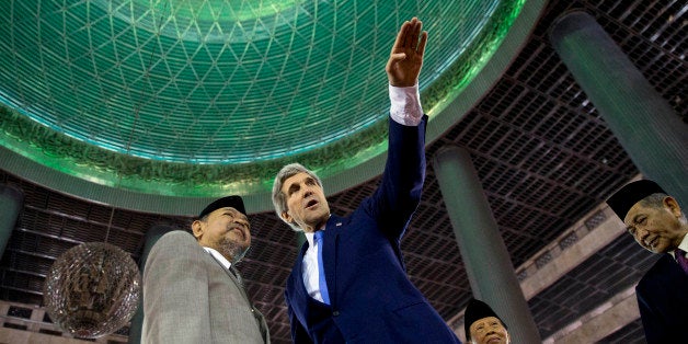 US Secretary of State John Kerry (R) tours the Istiqlal Mosque with Grand Imam K.H. Ali Mustafa Yaqub in Jakarta on February 16, 2014. Kerry arrived in Indonesia on a visit to highlight concerns over climate change, after agreeing with China to boost joint efforts to fight global warming. AFP PHOTO / POOL (Photo credit should read Evan Vucci/AFP/Getty Images)