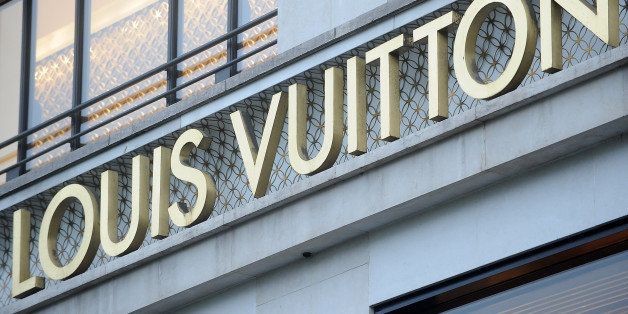 A Louis Vuitton logo is displayed outside the brands store in Paris, France, on Thursday, March 31, 2011. LVMH Moet Hennessy Louis Vuitton SA Chief Executive Officer Bernard Arnault repeated he doesn't plan on taking control of Hermes International SCA, in which his company has built up a 20.2 percent stake. Photographer: Antoine Antoniol/Bloomberg via Getty Images
