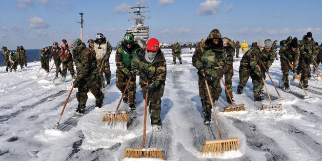 AT SEA - MARCH 23: (EDITORS NOTE: Image has been reviewed by U.S. Military prior to transmission.) In this handout image provided by the U.S. Navy, sailors scrubbed the external surfaces on the flight deck and island superstructure to remove potential radiation contamination. Ronald Reagan is operating off the coast of Japan providing humanitarian assistance as directed in support of Operation Tomodachi. A 9.0 magnitude strong earthquake struck offshore on March 11 at 2:46pm local time, triggering a tsunami wave of up to ten meters which engulfed large parts of north-eastern Japan, and also damaging the Fukushima nuclear plant and threatening a nuclear catastrophe. The death toll continues to rise with numbers of dead and missing exceeding 20,000 in a tragedy not seen since World War II in Japan. (Photo by Mass Communication Specialist Seaman Nicholas A. Groesch/U.S. Navy via Getty Images)