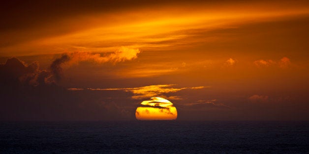 UNITED KINGDOM - FEBRUARY 07: Sun setting in the west over the ocean at Woolacombe, North Devon, UK (Photo by Tim Graham/Getty Images)