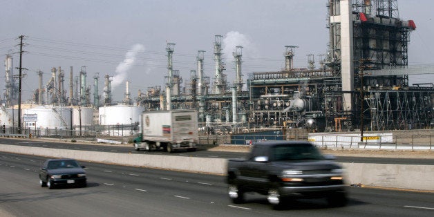 UNITED STATES - JANUARY 29: Traffic passes by the Royal Dutch Shell Plc oil refinery in Wilmington, California, Monday, Jan. 29. 2007. Tesoro Corp., the second-largest refiner in the Western U.S., agreed to buy Royal Dutch Shell Plc's plant near Los Angeles, seen here, and 250 filling stations for $1.63 billion to lift its capacity to process low-cost crude. (Photo by Tim Rue/Bloomberg via Getty Images)