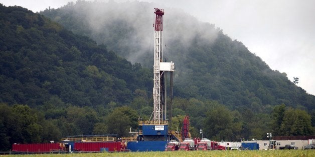 FAIRFIELD TOWNSHIP, PA - SEPTEMBER 8: A soybean field lies in front of a natural gas drilling rig September 8, 2012 near Montoursville, Pennsylvania. The area sits above the Marcellus Shale where the search for natural gas uses a controversial method known as hydrofracking. Hydrofracking involves pumping millions of gallons of water, sand and chemicals into horizontally drilled wells to stimulate the release of the gas. The Marcellus Shale gas field stretches diagonally across West Virginia, Ohio, Pennsylvania and New York State. Drilling operations have provided Pennsylvania with billions of dollars of income through employment and tax revenue. (Photo by Robert Nickelsberg/Getty Images)