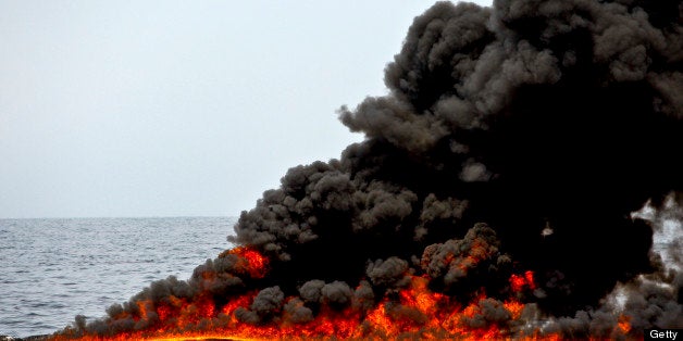 A controlled burn of oil is conducted near the source of the BP Plc Deepwater Horizon oil spill in the Gulf of Mexico off the coast of Louisiana, U.S., on Thursday, July 15, 2010. BP Plc said that a pressure test on its damaged Macondo well halted the flow of oil into the Gulf for the first time in three months. The oil spill, the biggest in U.S. history, had been spewing 35,000 to 60,000 barrels of oil a day since the drilling rig exploded on April 20. Photographer: Derick E. Hingle/Bloomberg via Getty Images