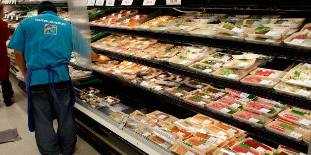 SAN FRANCISCO - JANUARY 23: A worker at the Nijiya Market stocks cooler shelves with fresh sashimi January 23, 2008 in San Francisco, California. According to a newspaper report, a new study found that samples of bluefin tuna sashimi contained high levels of mercury in several New York City restaurants. (Photo by Justin Sullivan/Getty Images)