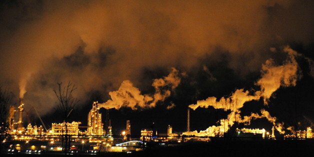 A night view of the Syncrude oil sands extraction facility near the town of Fort McMurray in Alberta Province, Canada on October 22, 2009. Greenpeace is calling for an end to oil sands mining in the region due to their greenhouse gas emissions and have recently staged sit-ins which briefly halted production at several mines. At an estimated 175 billion barrels, Alberta's oil sands are the second largest oil reserve in the world behind Saudi Arabia, but they were neglected for years, except by local companies, because of high extraction costs. Since 2000, skyrocketing crude oil prices and improved extraction methods have made exploitation more economical, and have lured several multinational oil companies to mine the sands. AFP PHOTO/Mark RALSTON (Photo credit should read MARK RALSTON/AFP/Getty Images)