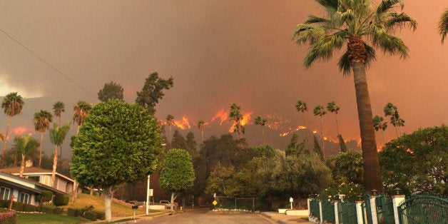 AP10ThingsToSee - A wildfire burns in the hills just north of the San Gabriel Valley community of Glendora, Calif. on Thursday, Jan 16, 2014. Southern California authorities have ordered the evacuation of homes at the edge of a fast-moving wildfire burning in the dangerously dry foothills of the San Gabriel Mountains. (AP Photo/Nick Ut)