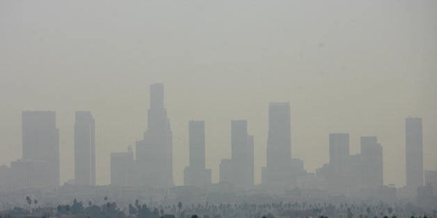 Los Angeles, UNITED STATES: TO GO WITH AFP STORY: USA-Justice-Environment-Climate (FILES) General view of the air pollution over Downtown Los Angeles, 20 September 2006. Several US states and environmental organizations engaged in the fight against golobal warming have succeeded in taking their case to the US Supreme Court. On 29 November 2006, the justices will hear arguments on whether the Clean Air Act requires the Environmental Protection Agency (EPA) to do something about global warming. The EPA claims the US Congress has not authorized it to regulate greenhouse gases. AFP PHOTO/GABRIEL BOUYS/FILES (Photo credit should read GABRIEL BOUYS/AFP/Getty Images)