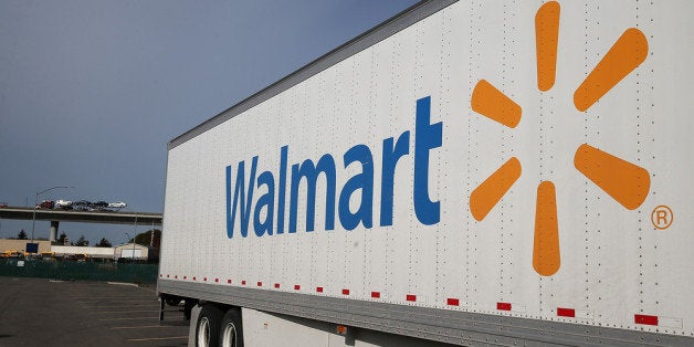 SAN LORENZO, CA - FEBRUARY 20: A Wal-Mart truck sits outside of a Wal-Mart store on February 20, 2014 in San Lorenzo, California. Wal-Mart reporterd a 21 percent decline in fourth quarter earnings with profits of $4.4 billion or $1.36 a share compared to $5.6 billion, or $1.67 per share one year ago. (Photo by Justin Sullivan/Getty Images)