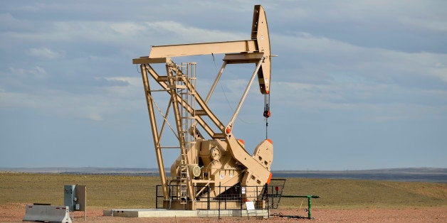 An oil rig in afternoon light in the state of Wyoming.