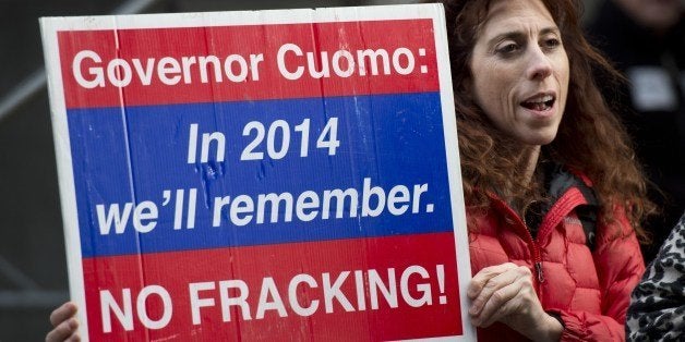 An opponent of the hydraulic fracturing shouts during a demonstration at the site of a Democratic party fundraiser March 20, 2014 in New York. The demonstrators say 'fracking,' the process used in natural gas drilling, is dangerous for water supplies and food sources. AFP PHOTO/Don Emmert (Photo credit should read DON EMMERT/AFP/Getty Images)