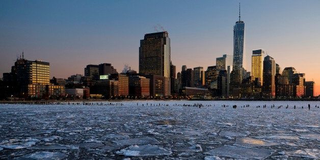 NEW YORK, NY - JANUARY 09: Ice floes fill the Hudson River as the Lower Manhattan skyline is seen during sunset on January 9, 2014 in New York City. A recent cold spell, caused by a polar vortex descending from the Arctic, caused the floes to form in the Hudson. (Photo by Afton Almaraz/Getty Images)