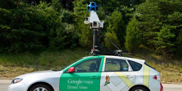 This June 28, 2012 photo shows a Google Street View vehicle as it collects imagery while driving down Interstate I-66 near Centreville, Virginia. This current vehicle has 15 lenses taking 360 degrees of photos. It also has motion sensors to track its position, a hard drive to store data, a small computer running the system, and lasers to capture 3D data to determine distances within the Street View imagery. AFP PHOTO/Karen BLEIER (Photo credit should read KAREN BLEIER/AFP/GettyImages)