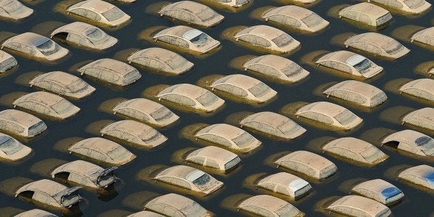 (FILES) This aerial picture taken on November 19, 2011 shows cars submerged in floodwaters at a Honda automotive factory at a