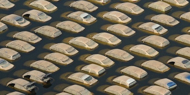 (FILES) This aerial picture taken on November 19, 2011 shows cars submerged in floodwaters at a Honda automotive factory at an industrial estate in Ayutthaya province. Thailand's economy suffered a double-digit contraction in the fourth quarter of 2011, the sharpest on record, it said on February 20, 2012 after the kingdom's worst floods in half a century pummelled industry. AFP PHOTO / Pornchai KITTIWONGSAKUL / FILES (Photo credit should read PORNCHAI KITTIWONGSAKUL/AFP/Getty Images)