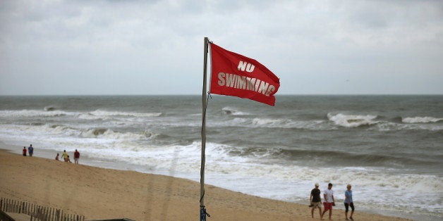 NAGS HEAD, NC - JULY 04: No swimming flags are posted due to the heavy surf left by Hurricane Arthur, July 4, 2014 in Nags Head, North Carolina. Hurricane Arthur hit North Carolina's outer banks overnight causing wide spead power outages, flooding and damage, and has since weakened to a Category 1 as of Friday morning. (Photo by Mark Wilson/Getty Images)