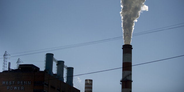 NEW EAGLE, PA - SEPTEMBER 24: A plume of exhaust extends from the Mitchell Power Station, a coal-fired power plant located 20 miles southwest of Pittsburgh, on September 24, 2013 in New Eagle, Pennsylvania. The plant, owned by FirstEnergy, will be one of two plants in the region to be shut down, affecting 380 employees. The Evironmental Protection Agency (EPA) and the Obama administration have been taking major steps to get coal-fired power plants into compliance with clean air regulations. (Photo by Jeff Swensen/Getty Images)