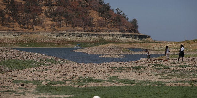 IONE, CA - AUGUST 08: Visitors walk on what used to be the bottom of the Camanche Reservoir on August 8, 2014 in Ione, Calif
