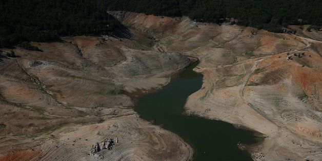 OROVILLE, CA - AUGUST 19: A stream of water trickles through a section of Lake Oroville that used to be under water on August 19, 2014 in Oroville, California. As the severe drought in California continues for a third straight year, water levels in the State's lakes and reservoirs is reaching historic lows. Lake Oroville is currently at 32 percent of its total 3,537,577 acre feet. (Photo by Justin Sullivan/Getty Images)
