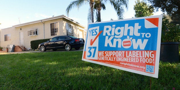 A sign supporting Proposition 37 which calls for the mandatory labeling of genetically engineered foods is seen in front of a