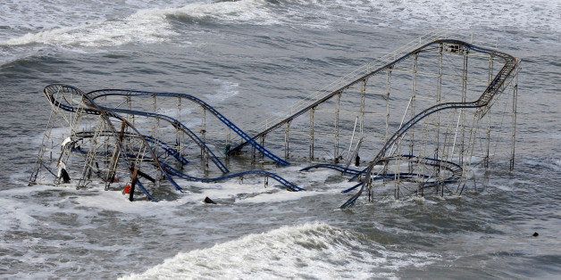 FILE - In this Wednesday, Oct. 31, 2012 file photo, waves wash over a roller coaster from a Seaside Heights, N.J. amusement park that fell in the Atlantic Ocean during superstorm Sandy. Though itâs tricky to link a single weather event to climate change, Hurricane Sandy was âprobably not a coincidenceâ but an example of extreme weather events that are likely to strike the US more often as the world gets warmer, the U.N. climate panelâs No. 2 scientist told the Associated Press Tuesday, Nov. 27, 2012.(AP Photo/Mike Groll, File)
