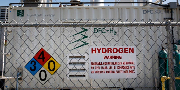 Warning signs are displayed as gas is produced in the tri-generation power and hydrogen system at the Orange County Sanitation District waste-treatment facility in Fountain Valley, California, U.S., on Wednesday, Feb. 5, 2014. California plans to spend $20 million a year for a decade for dozens of new hydrogen stations as carmakers including Hyundai, Toyota, Honda and Daimlers Mercedes-Benz try to entice Californians to buy fuel cell vehicles. Photographer: Patrick T. Fallon/Bloomberg via Getty Images