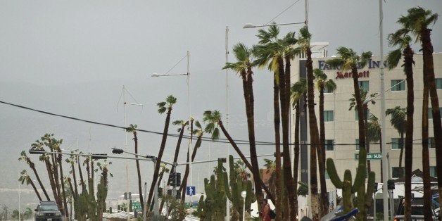 View of main road leading to Cabo San Lucas seen after hurricane Odile knocked down trees and power lines in the city, in Mexico's Baja California peninsula, on September 15, 2014. Odile weakened to category two on the five-level Saffir-Simpson scale but still packed powerful winds of 175 kilometers (110 miles) per hour after crashing ashore overnight near Cabo San Lucas, according to the US National Hurricane Center. Some 24,000 foreign tourists and 6,000 Mexican beachgoers spent the night in hotels where conference rooms were transformed into shelters. AFP PHOTO/RONALDO SCHEMIDT (Photo credit should read RONALDO SCHEMIDT/AFP/Getty Images)