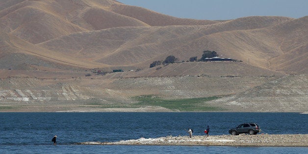 GUSTINE, CA - SEPTEMBER 05: A car is parked on a section of the San Luis Reservoir that used to be under water on September 5