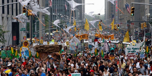 Demonstrators make their way down Sixth Avenue in New York during the People's Climate March Sunday, Sept. 21, 2014. The march, along with similar gatherings scheduled in other cities worldwide, comes two days before the United Nations Climate Summit, where more than 120 world leaders will convene for a meeting aimed at galvanizing political will for a new global climate treaty by the end of 2015. (AP Photo/Jason DeCrow)