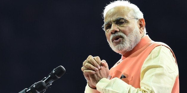 Prime Minister Narendra Modi of India speaks to supporters during a community reception September 28, 2014 at Madison Square Garden in New York. Modi received a rock star reception as thousands cheered on the new right-wing leader in a packed arena. Modi, a Hindu nationalist who swept to power earlier this year, addressed the United Nations on September 27 at the start of a visit to the United States, which is eager to court him after shunning the right-wing leader for a decade. AFP PHOTO/Don Emmert (Photo credit should read DON EMMERT/AFP/Getty Images)