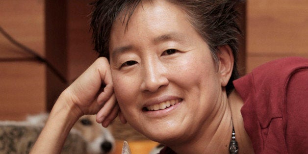 In this photo taken Monday, Aug. 15, 2011, Dr. Sophia Yin, executive board member of the American Veterinary Society of Animal Behavior, is seen with Dante at her home in Davis, Calif. When Yin rescued Dante, she discovered he had spraying problems. Yin, who was able to cure Dante's spraying, said that if a cat has been altered and has no health problems, spraying is a sign of stress and it's up to you to figure out the cause. (AP Photo/Rich Pedroncelli)