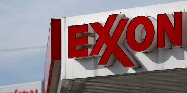 Exxon Mobil Corp. signage is displayed at a gas station in Cincinnati, Ohio, U.S. on Monday, Jan. 27, 2014. Exxon Mobil Corp. is scheduled to release their fourth quarter earnings on Thursday, Jan. 30, 2014. Exxon Mobil Corp. is scheduled to release earnings figures on Jan. 30. Photograper: Luke Sharrett/Bloomberg via Getty Images