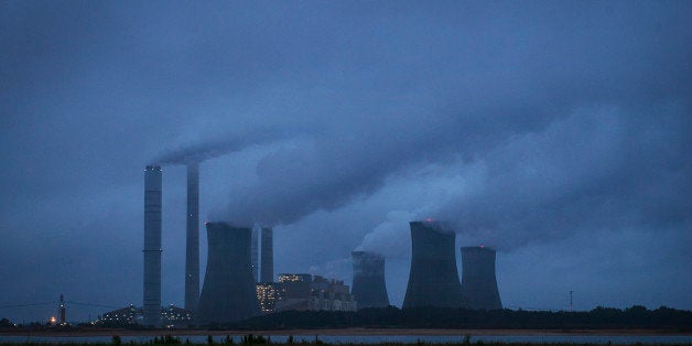 The coal-fired Plant Scherer is shown in operation early Sunday, June 1, 2014, in Juliette, Ga. The Obama administration unveiled a plan Monday to cut carbon dioxide emissions from power plants by nearly a third over the next 15 years, in a sweeping initiative to curb pollutants blamed for global warming. (AP Photo/John Amis)